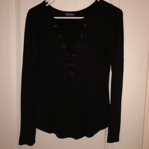Black long sleeve top. Lace up on the chest area.